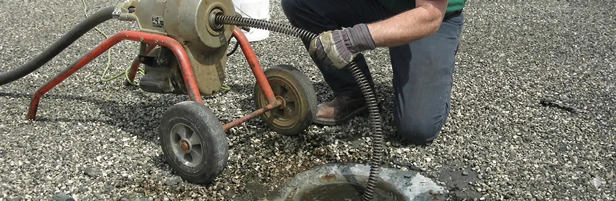 sewer rodding technician actively removing blockages from a sewer line in Detroit, MI